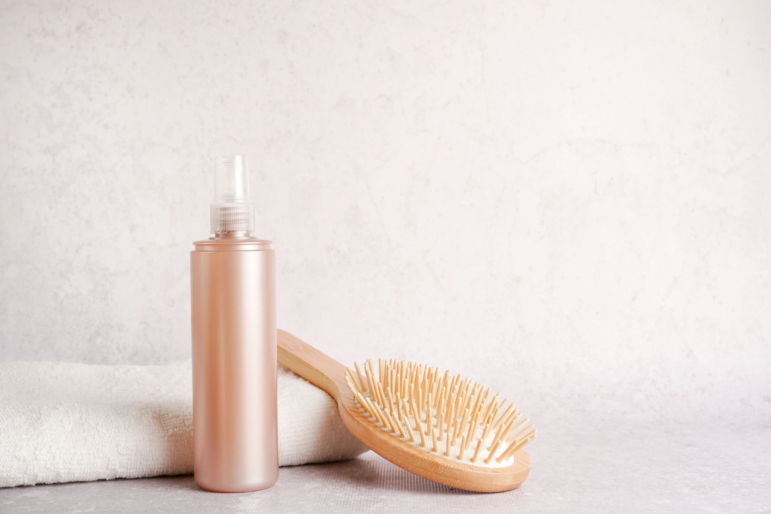 natural hair care product bottle on clean background
